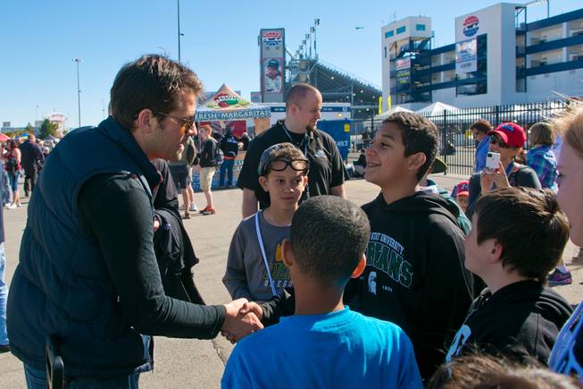 Misha Collins, from The CW's Supernatural and founder of the non-profit Random Acts, talks with kids from the Boys and Girls Club of Las Vegas during Random Acts' AMOK event at the Las Vegas Motor Speedway, Sunday March 10, 2013.